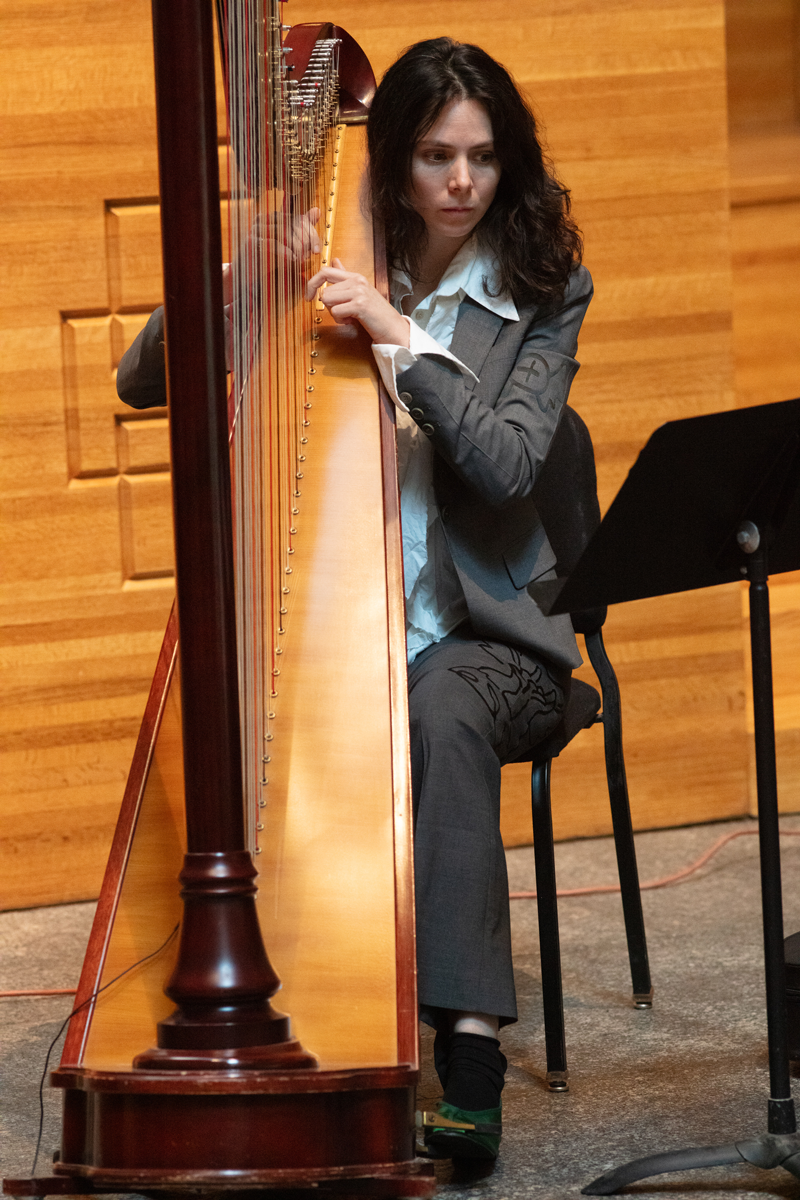 Esther Sibiude playing harp at Saint Peter's Lutheran Church with COTC